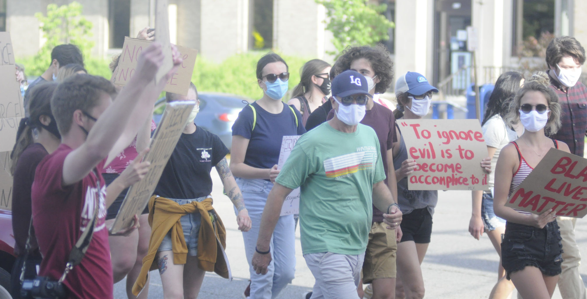 Protesters crossing Center Street in Lake Geneva